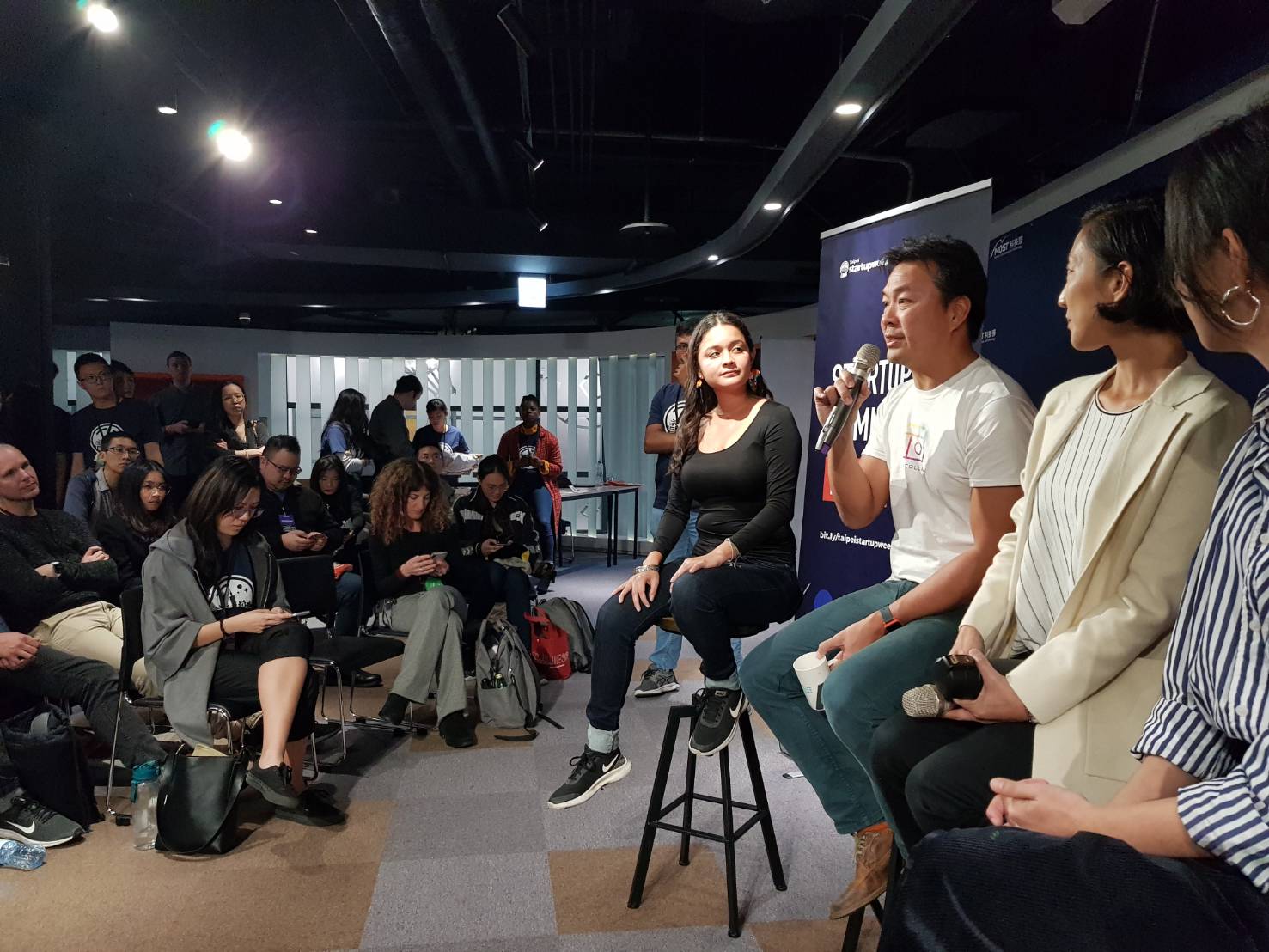 Cristina Fonseca speaking on a startup panel in Taipei